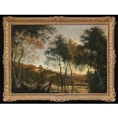 An Italianate landscape with a figure and his dog by a lake, a hill-town beyond 6