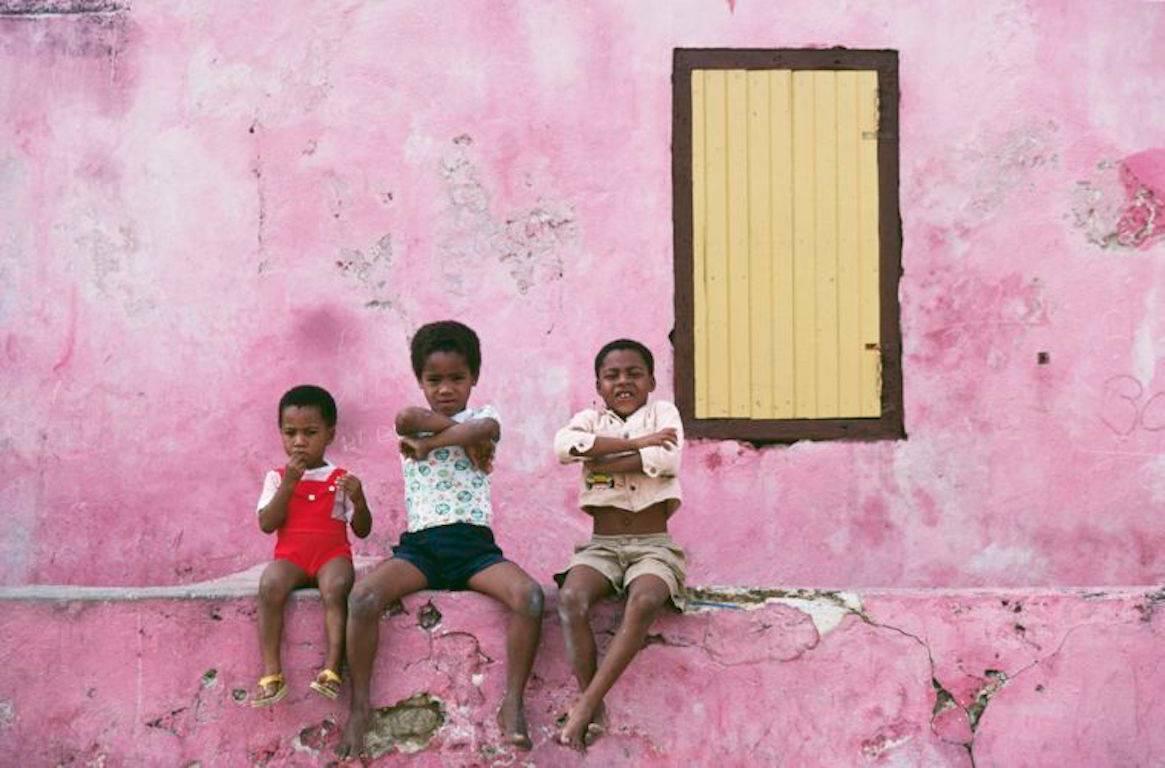 'Curacao Children' by Slim Aarons

Three local children sitting on a low wall, Curacao, Netherlands Antilles, January 1979.

An exquisite Open Edition Slim Aarons C-type Print.

Gorgeous print measuring an extra large inches / ca 101 x 76  cm's