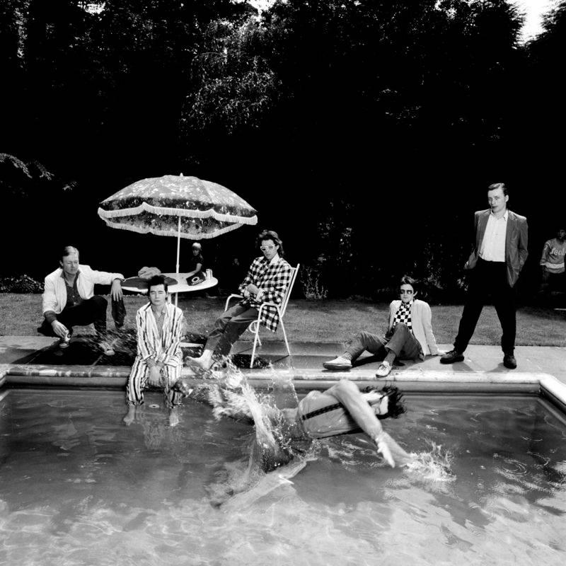 Fin Costello Black and White Photograph - 'Bob Geldof and Boomtown Rats Poolside'  (Silver Gelatin Print)