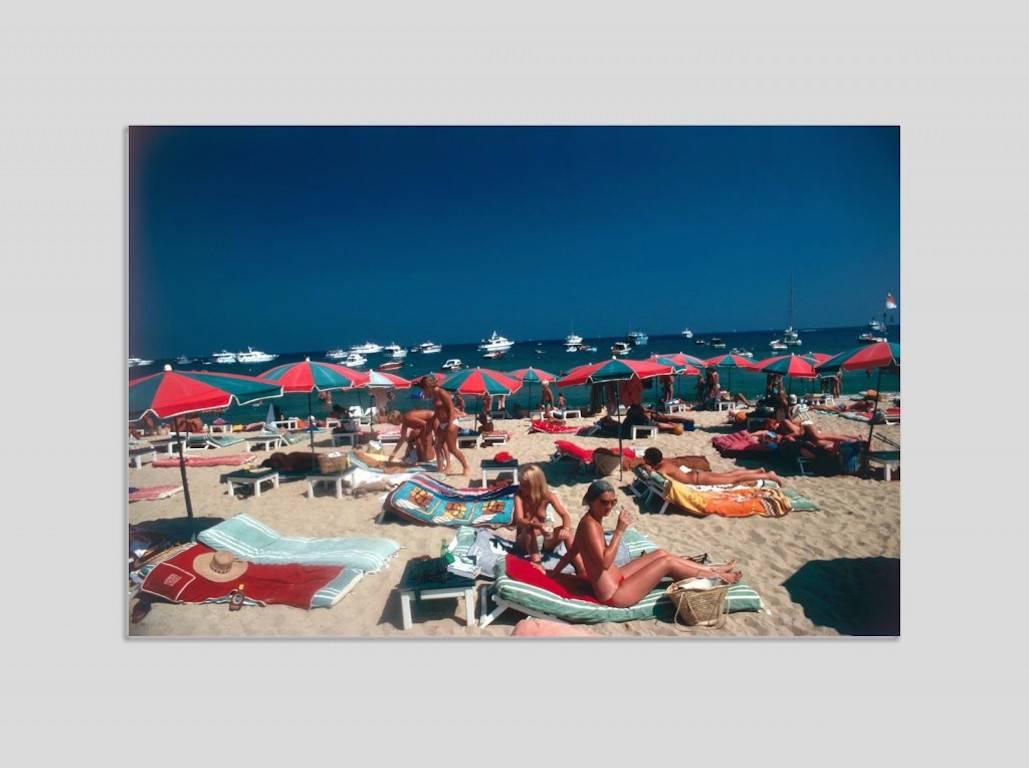 Slim Aarons Color Photograph - 'Beach At St Tropez' (Perspex face mounted Aluminium Dibond)