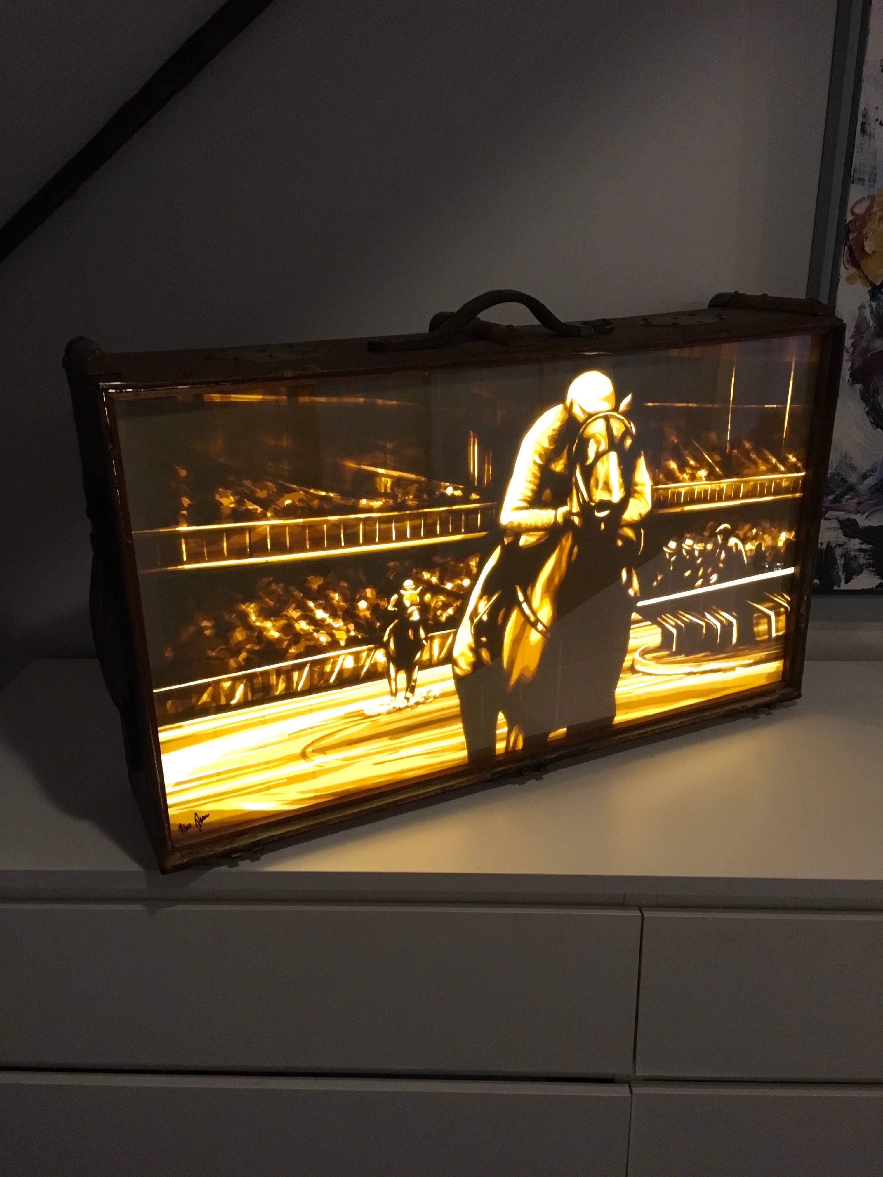 Brown packing tape on acrylic glass Framed in customized LED lightbox
antique suitcase

I have always being a fan of using the context of a city as the backdrop of art. But I felt that one aspect was underrepresented. Street art that appears at