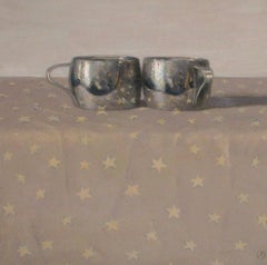 2 Silver Cups on Cloth with Gold Stars