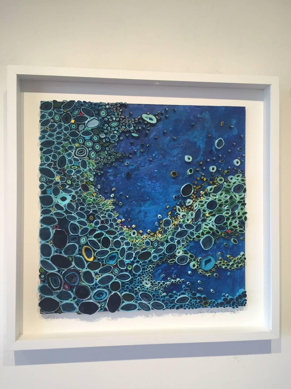 Mixed Media artist Amy Genser makes dimensional paper collages. These colorful, textural, one-of-a-kind wall pieces embody movement and processes. She masterfully manipulates paper -- each piece being cut, rolled and stacked -- to mimic organic
