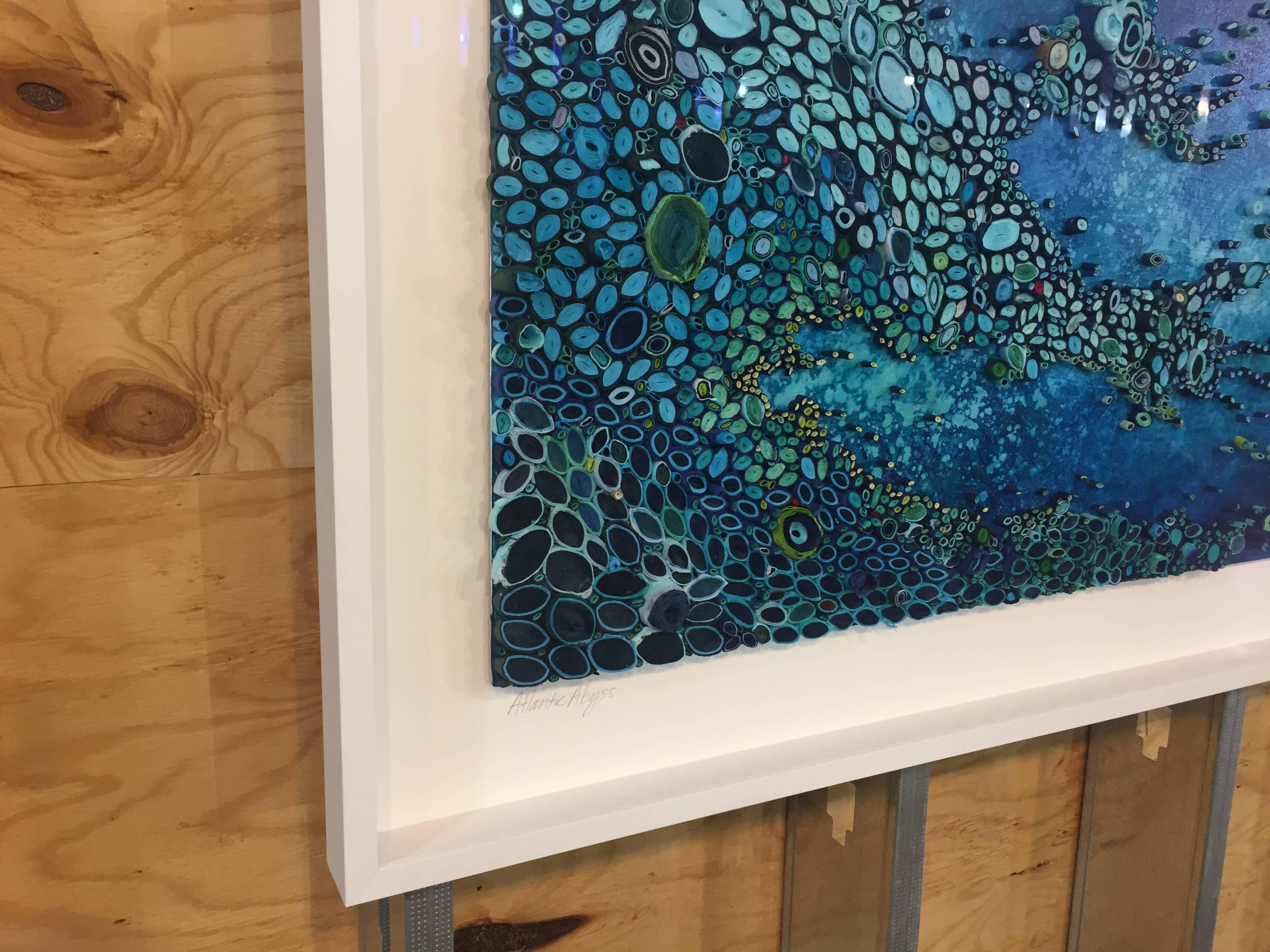 
Mixed Media artist Amy Genser makes dimensional paper collages. These colorful, textural, one-of-a-kind wall pieces embody movement and processes. She masterfully manipulates paper -- each piece being cut, rolled and stacked -- to mimic organic