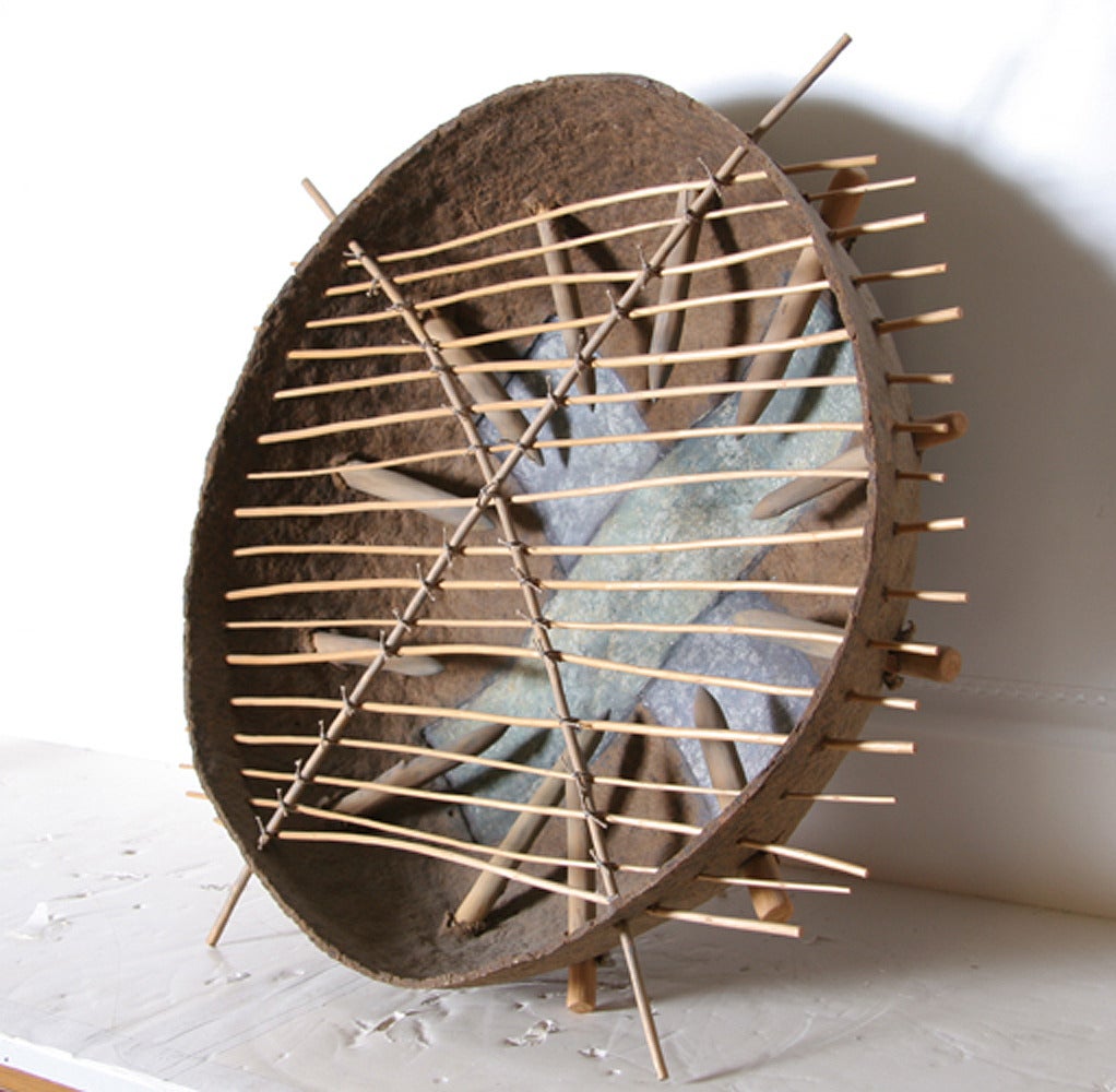 This mixed media sculpture by Sylvia Seventy, from 1986, is a conceptual work in neutral tones.  Materials include handmade paper, Apple Wood, Willow, Paint, Oil Pastel, Wax, Cotton Card and Glue.

Artist: Sylvia Seventy
Title:	Vessel: Pierced