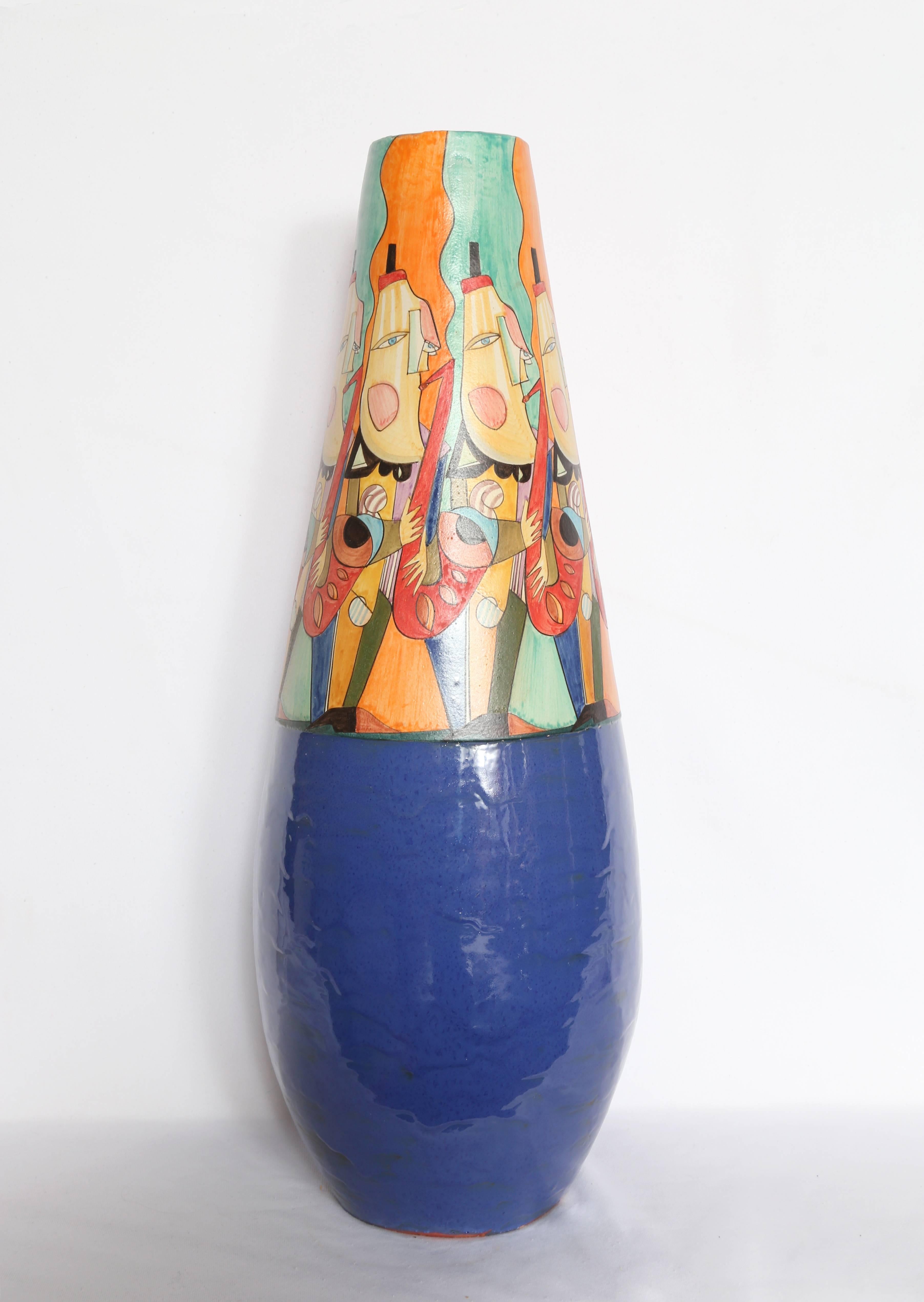 Artistics : Mirko' Guida (italien, né en 1980)
Titre : Cruche à fond bleu
Année : vers 2007
Moyen : Cruche en terre cuite peinte, signée 
Taille : 27.5  x 9  x 9 in. (69.85  x 22.86  x 22.86 cm)