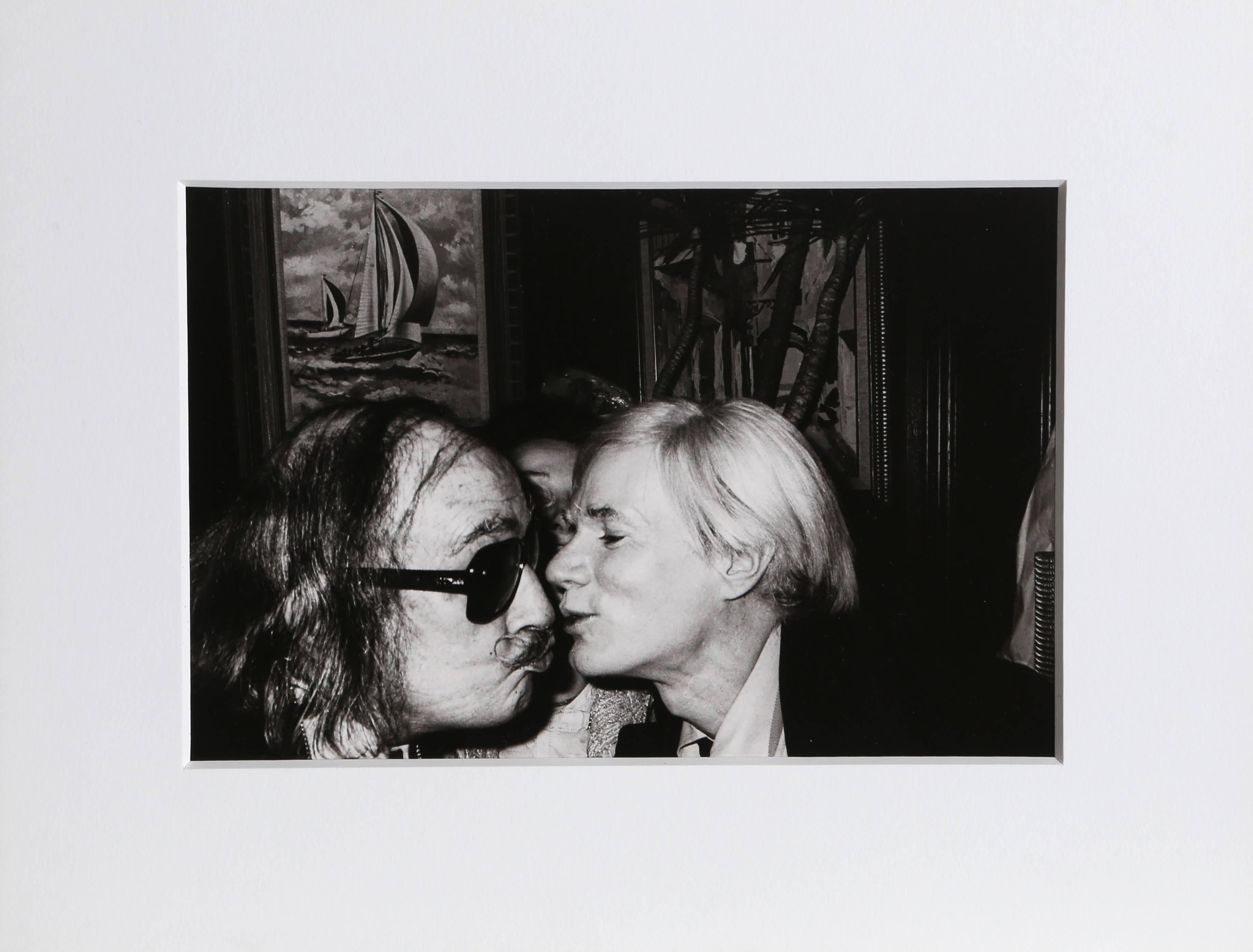 This gelatin silver print was created by American photographer Christopher Makos. Makos is well known for his relationships with icons like Andy Warhol, Tennessee Williams, and John Lennon. Later in life, Warhol called Makos the most modern