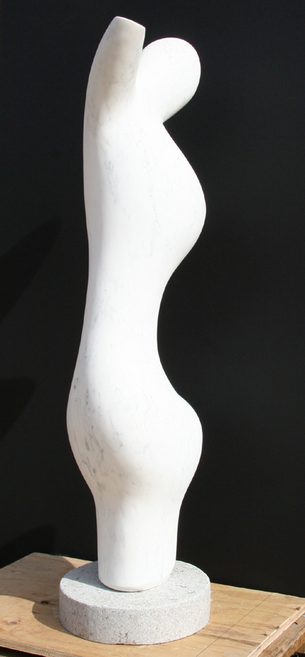 A white marble sculpture by Mario DeNoto. An modern abstract figure of subtly human like features and slight gray veining. 
 
Artist: Mario DeNoto
Title:	Abstract Figure
Medium:	White Marble Sculpture on a Granite Base
Size: 46 x14 x 10 inches