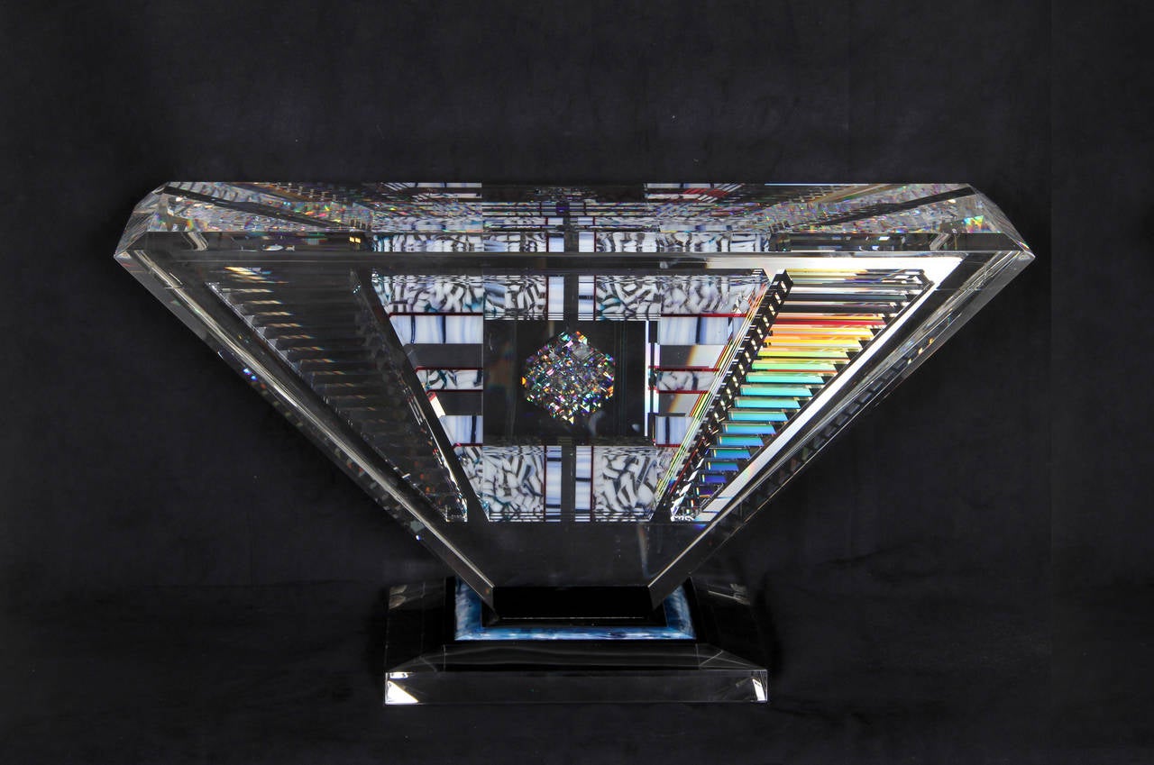 A polished glass sculpture by Joh Kuhn from 1992. A spectacular sculpture of crystal clear glass that forms a complicated prism in which light is reflected in a multitude of optical plays. 
 
Artist: Jon Kuhn, American (1949 - )
Title: Island