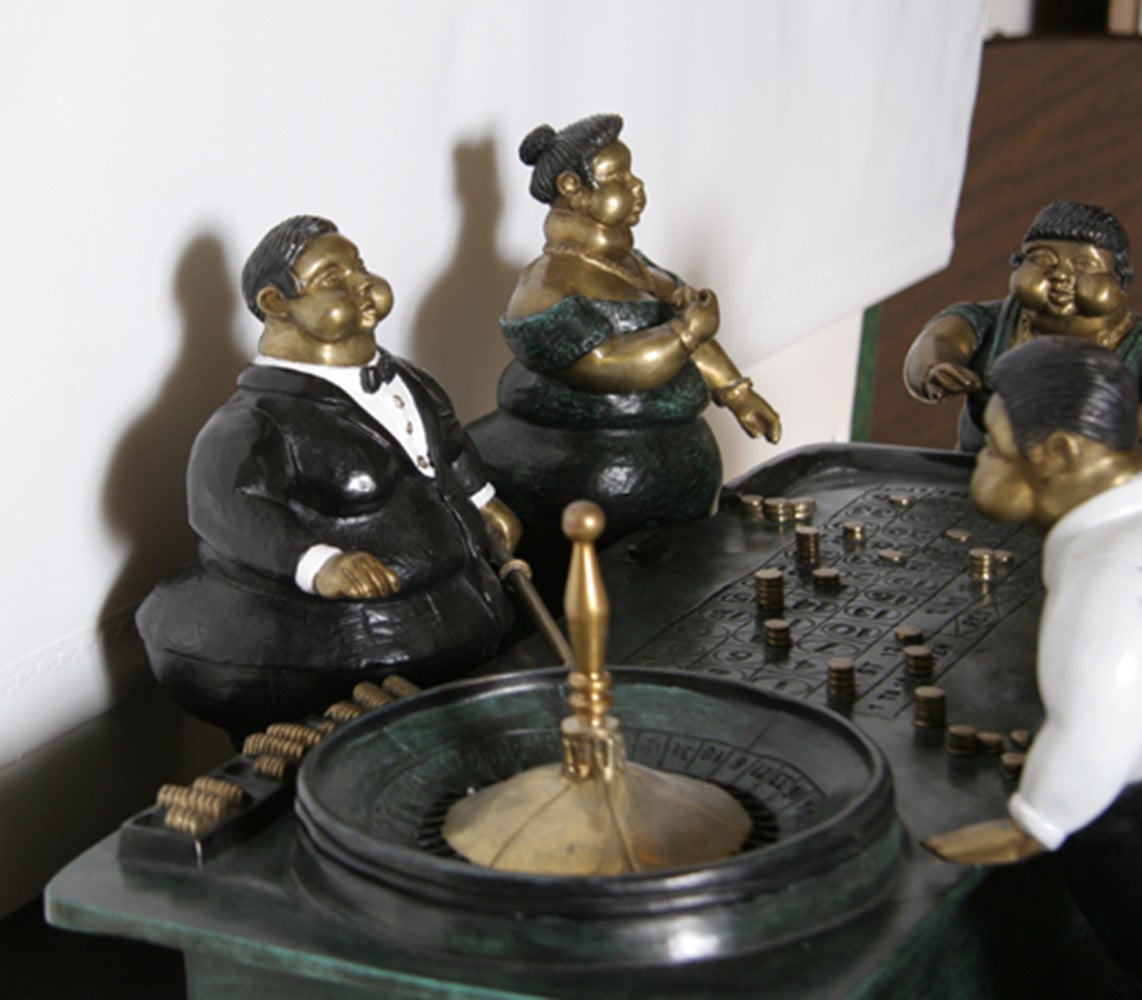 A bronze sculpture by Bruno Luna from 1990. A miniature scene of a roulette table populated by Botero-esque rotund figures. 

Artist: Bruno Luna, Mexican (1963 - )
Title:	Roulette
Year: circa 1990
Medium:	Bronze Sculpture, signature and number