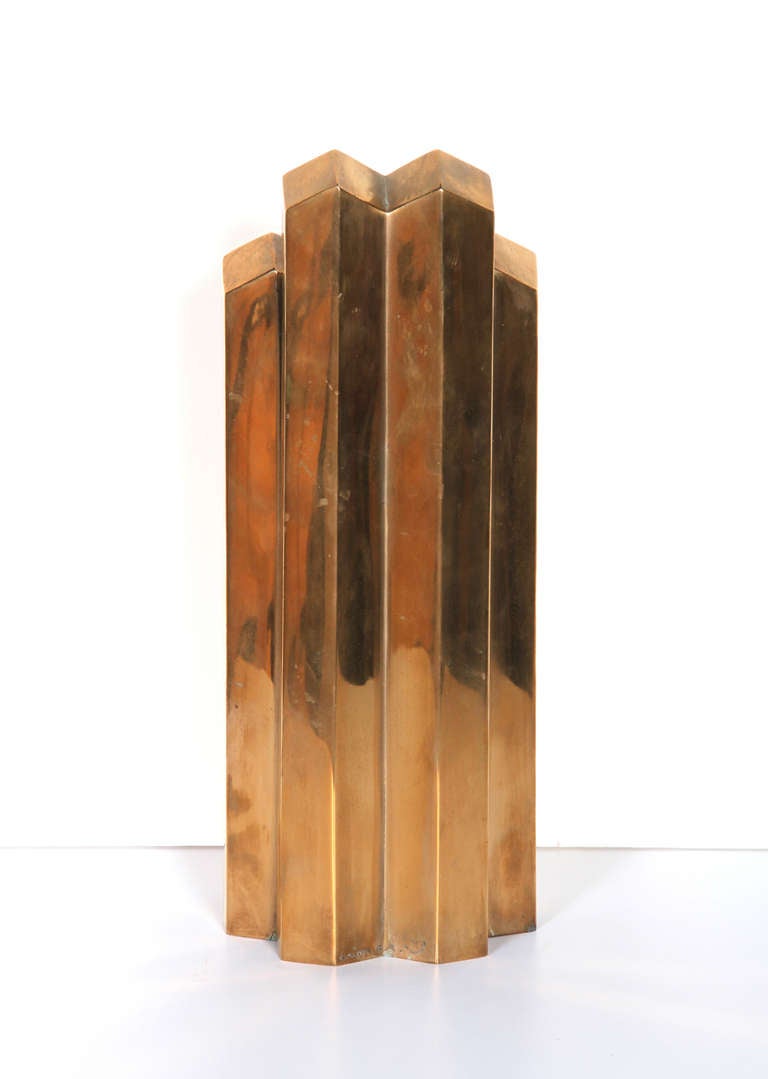 This stylish sculpture is a bronze skyscraper formed by six hexagonal shapes to make a a very hip modern op-art statement sculpture. This work will look great in an office or as the highlight in an entryway. The signature is inscribed, but the
