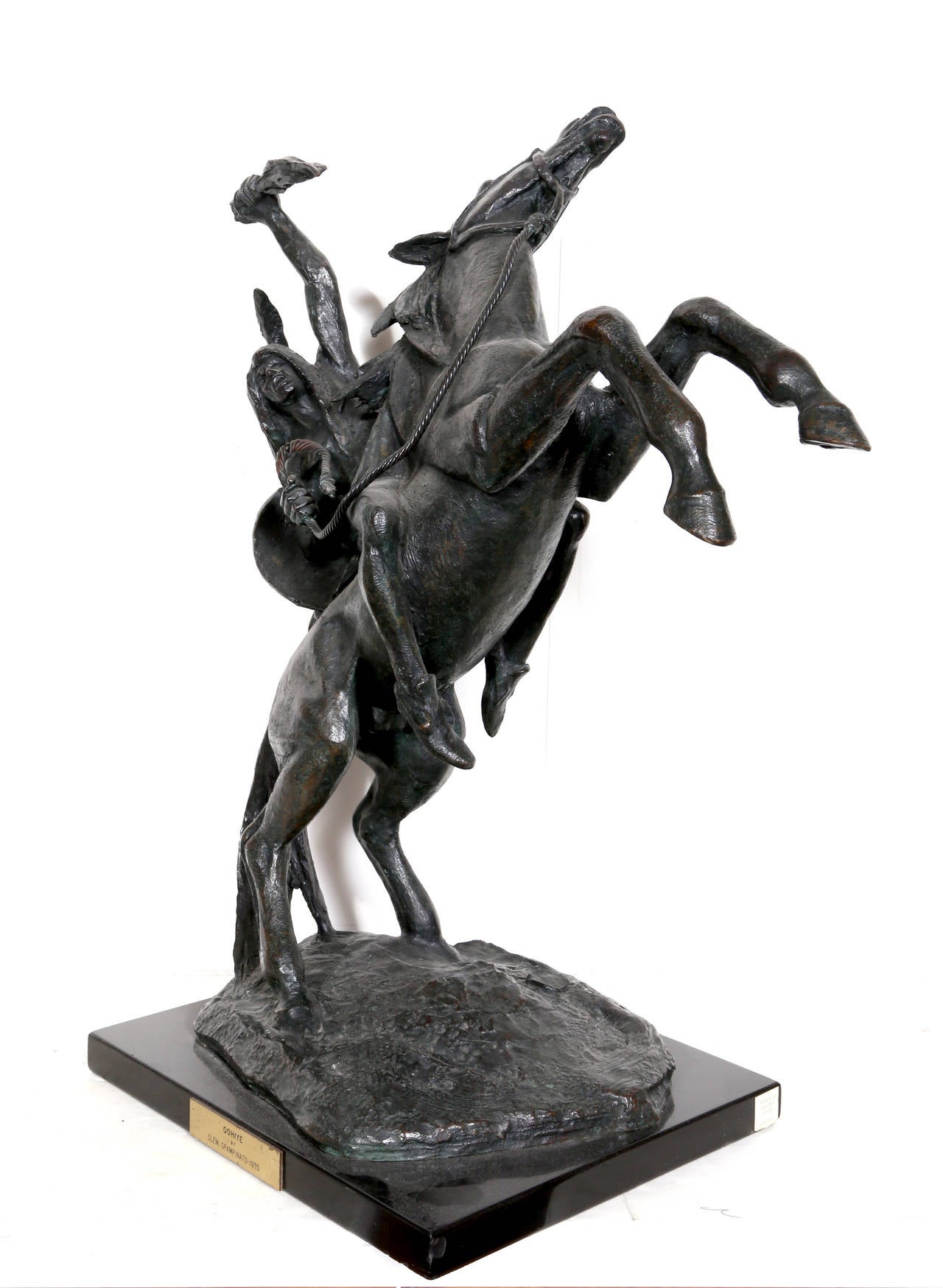 A classic relic from the American West, Spampinato's exquisite solid bronze sculpture is beauty, grace and action-packed. Signature inscribed on sculpture and plate stamped on base. 

Title: Oohiye
Year: 1970
Medium: Bronze
Size: 27.5 x 19 x