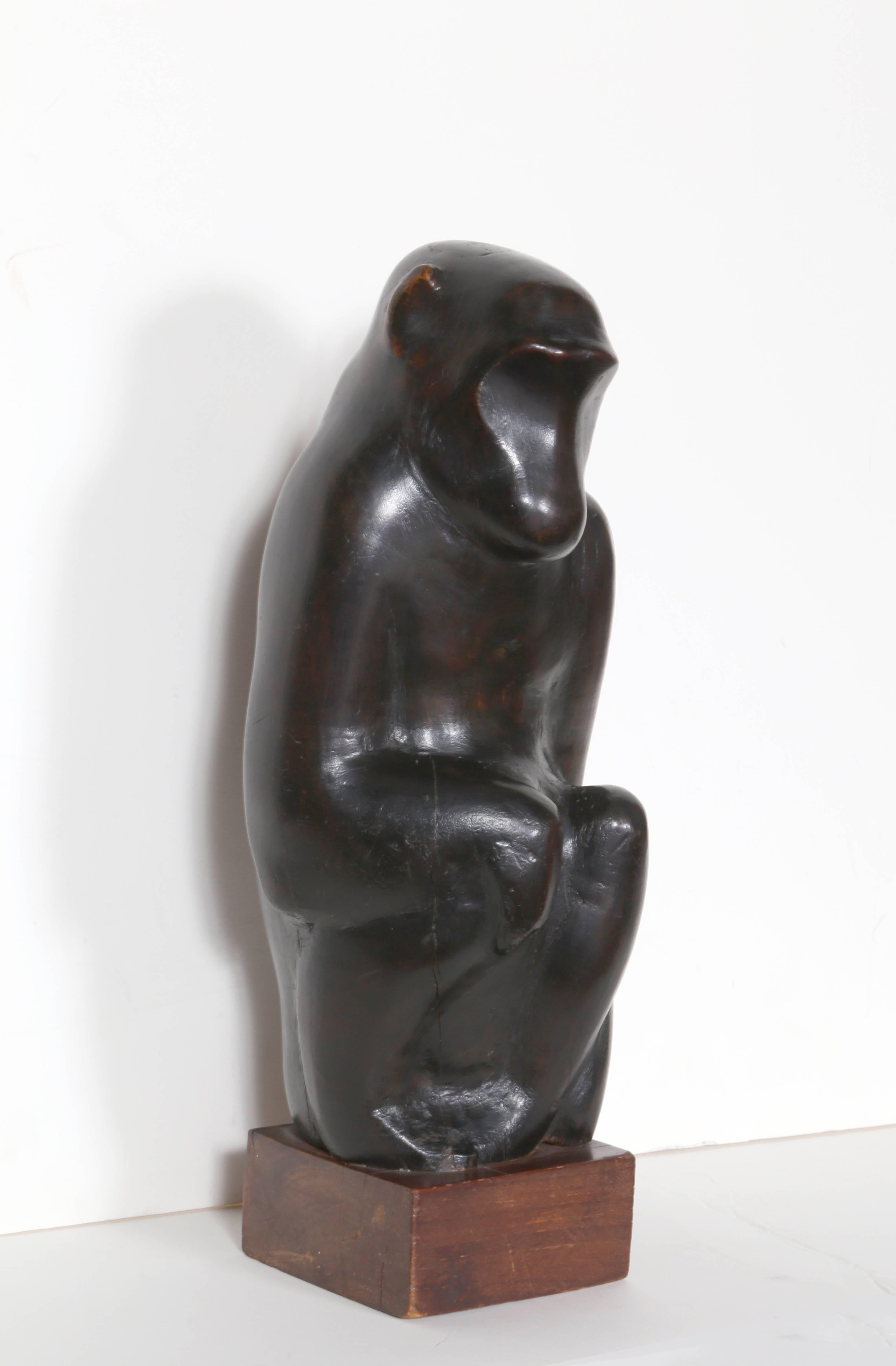 Artist: George Zachary Constant, Greek/American (1892 - 1978)
Title: Monkey
Year: circa 1954
Medium: Hand-Carved Wood Sculpture
Base Size: 4 x 4 x 2 inches
Size: 13.5  x 4.5  x 5.5 in. (34.29  x 11.43  x 13.97 cm)