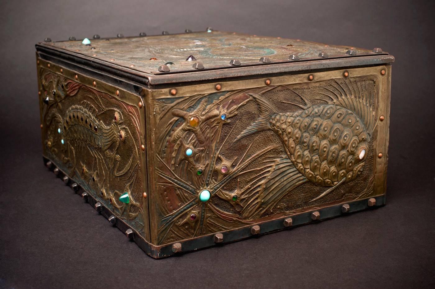 Daguet’s beautifully patinated cash box is a rich textural and colorful tour de force. So much more than an adaptation of Japanese wood block print sources to his metalwork craft, Daguet created a veritable 3-dimensional metal aquarium to charm the