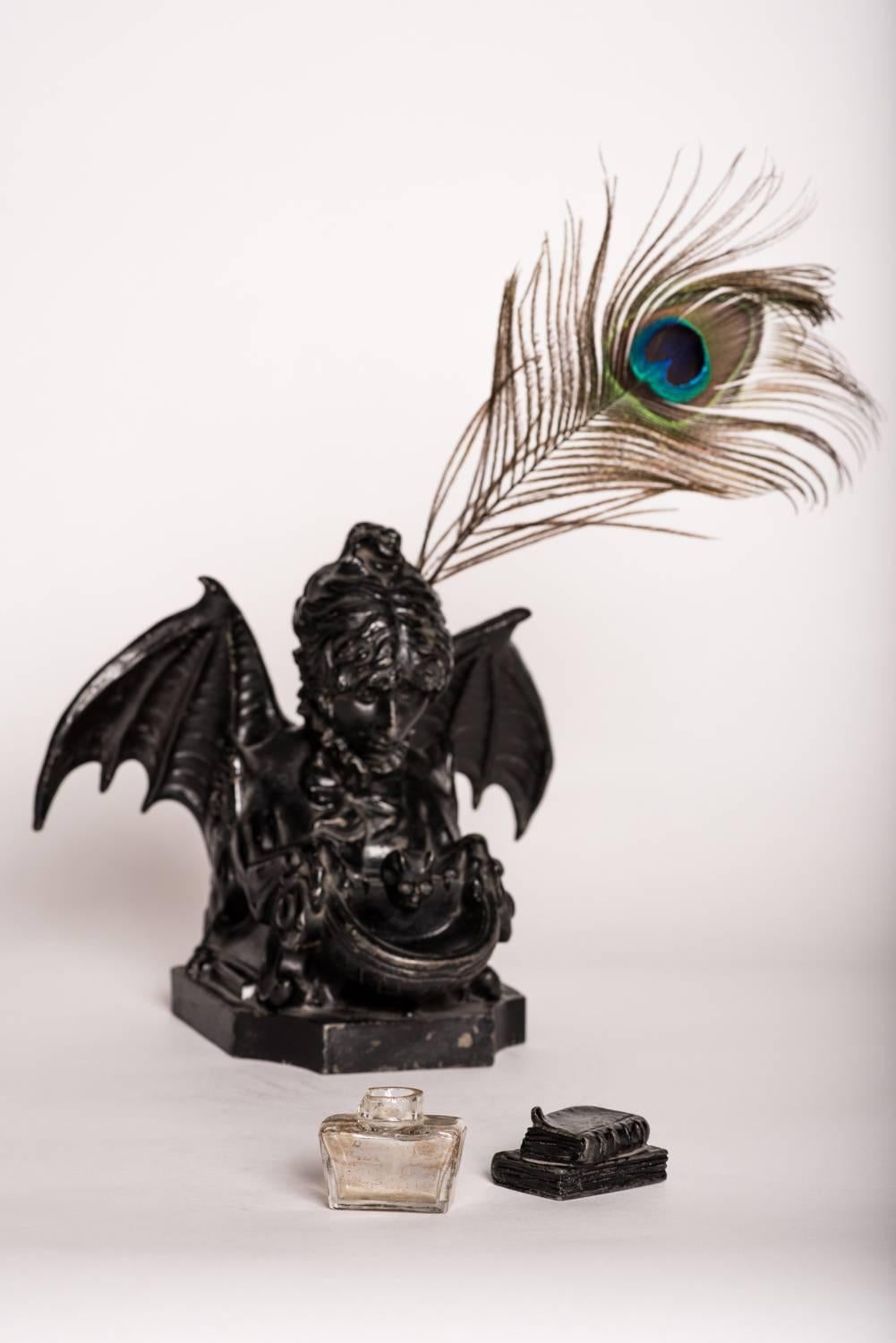 SYMBOLIST INKWELL: SELF-PORTRAIT AS A SPHINX, after SARAH BERNHARDT (1844-1923), spelter with a French Bronze finish, signed in the mould on side of base: “Sarah Bernhardt”; c.1890; Bernhardt's naturalistically rendered head, complete with a high