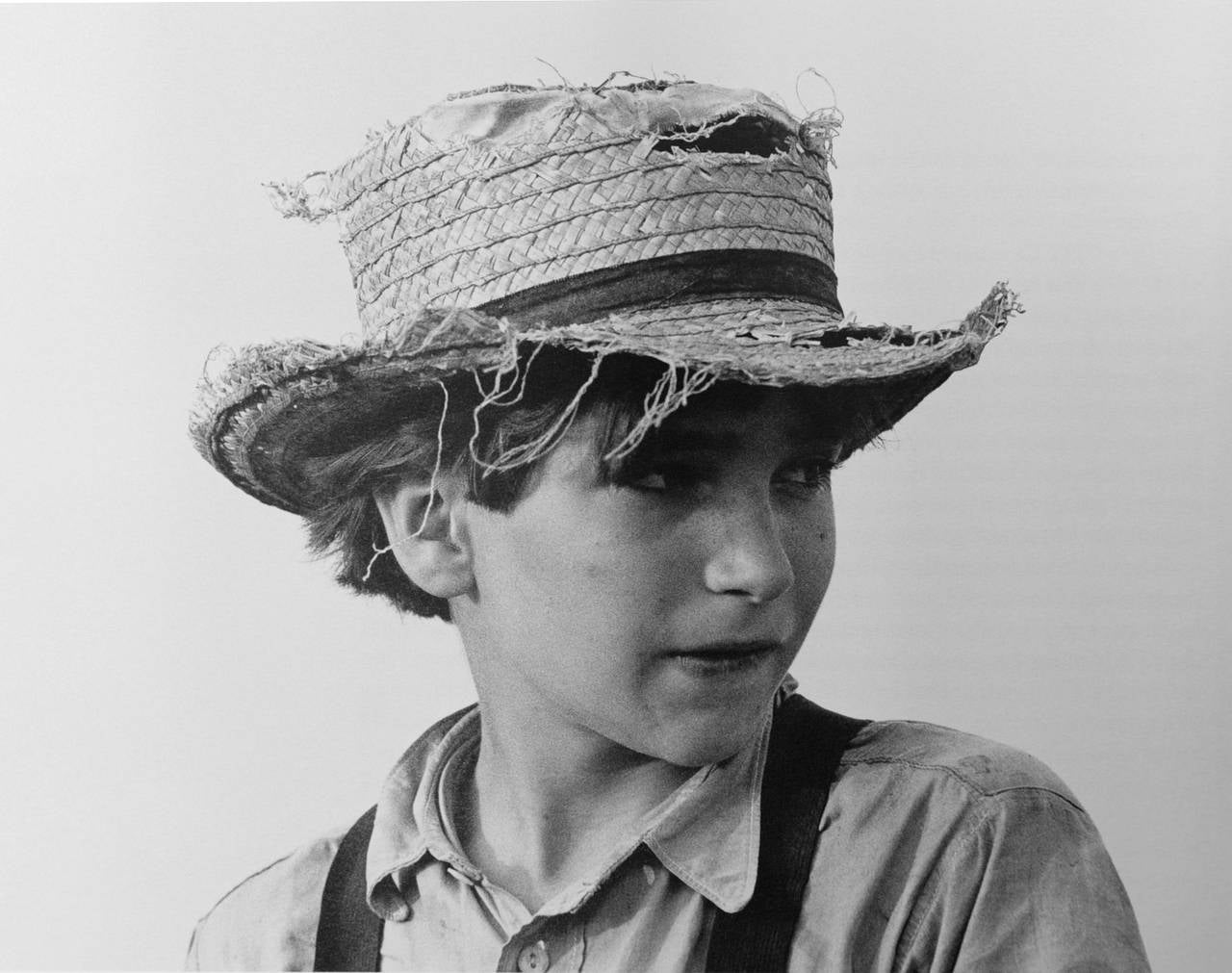 George Tice Black and White Photograph - Amish Boy with Straw Hat, Lancaster, PA