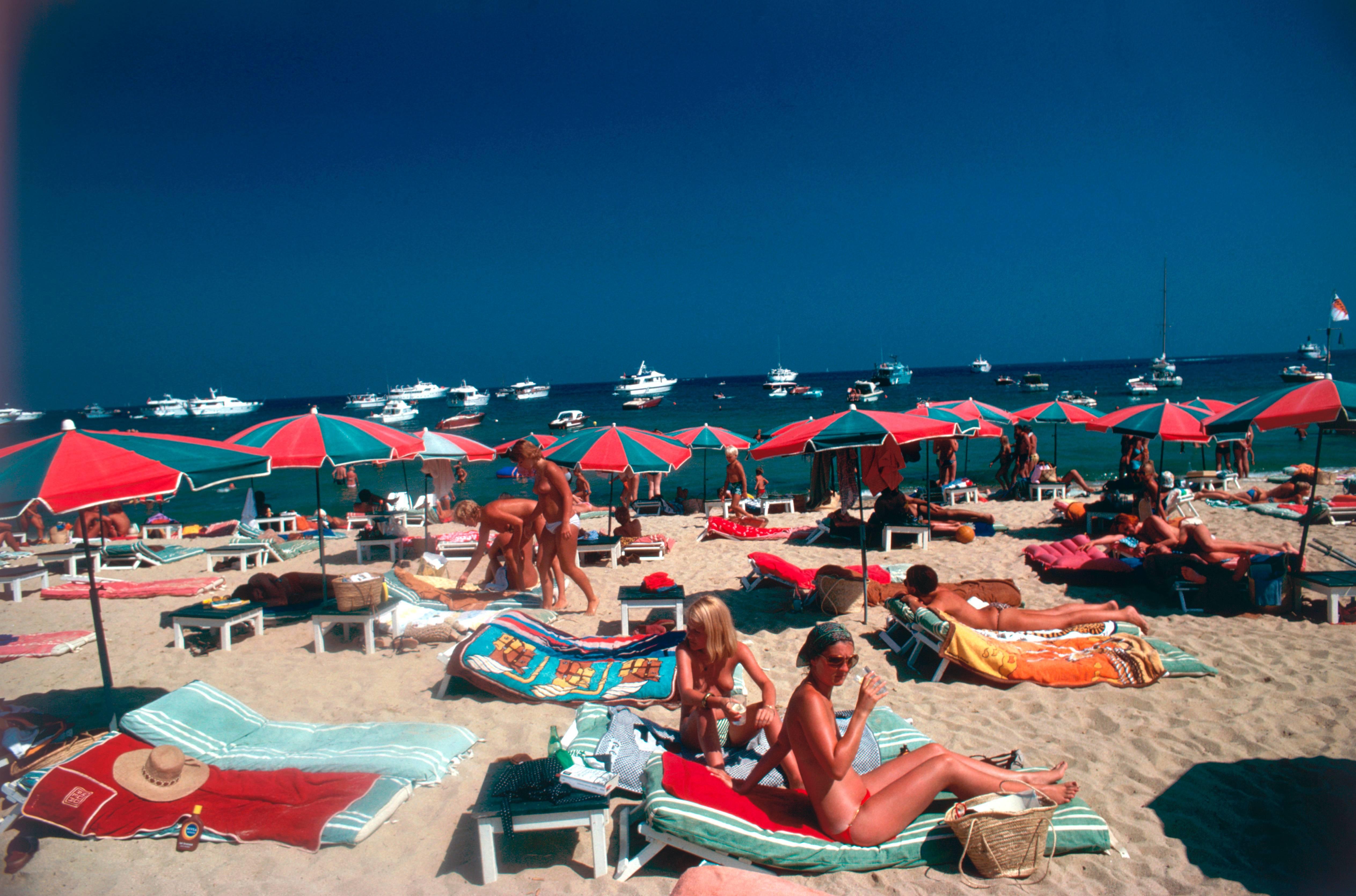 Sunbathers on the beach at St. Tropez, France, 1977. (Photo by Slim Aarons/Hulton Archive/Getty Images)

C-type print from the original transparency held at the Getty Images Archive, London. Numbered and stamped by The Slim Aarons Estate. 