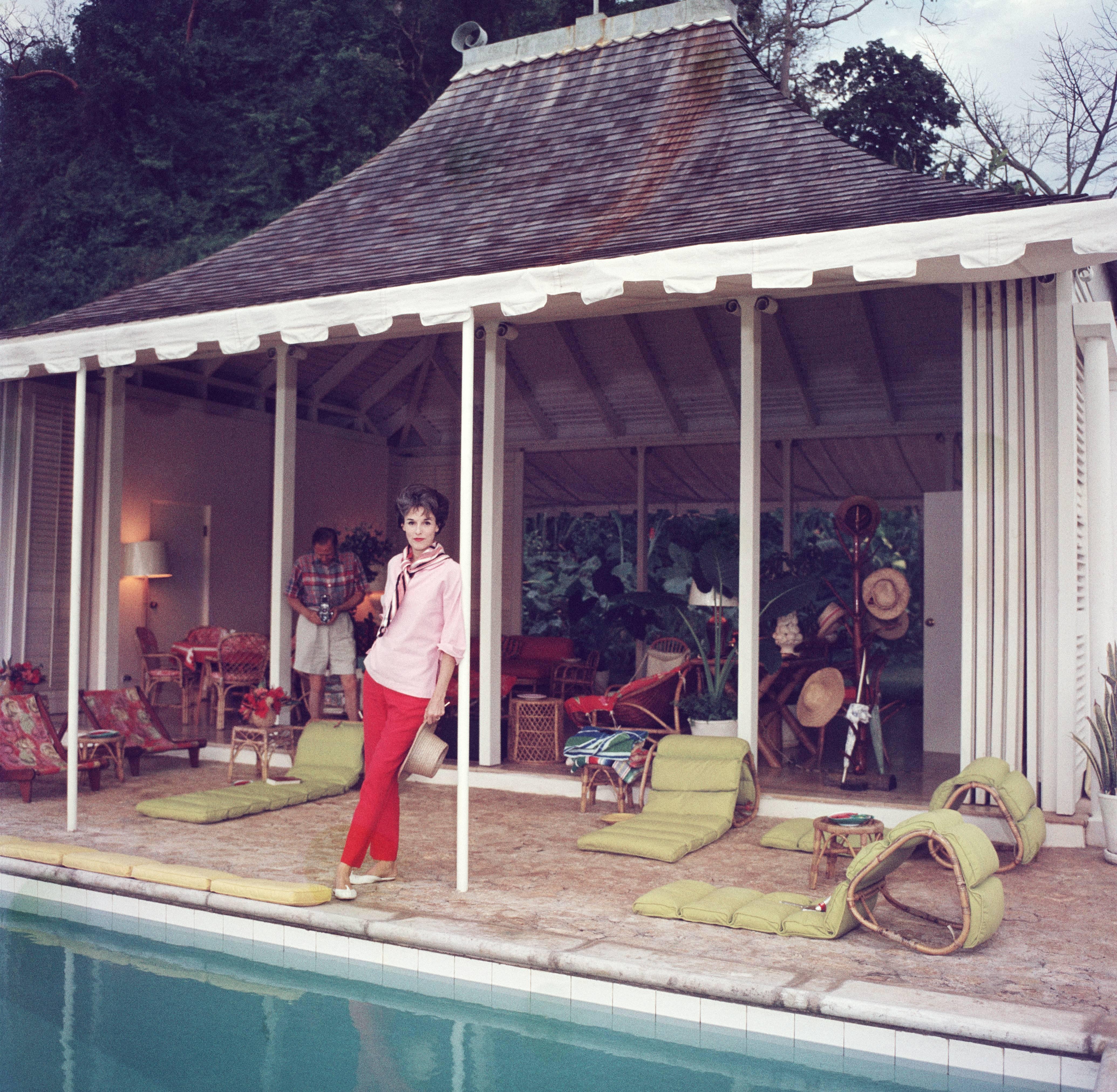 1959: Babe Paley (Mrs William Paley) by the pool. Her husband, William Paley is snapping the photographer at their cottage, Round Hill, Jamaica. A Wonderful Time - Slim Aarons (Photo by Slim Aarons/Getty Images)

C-type print from the original