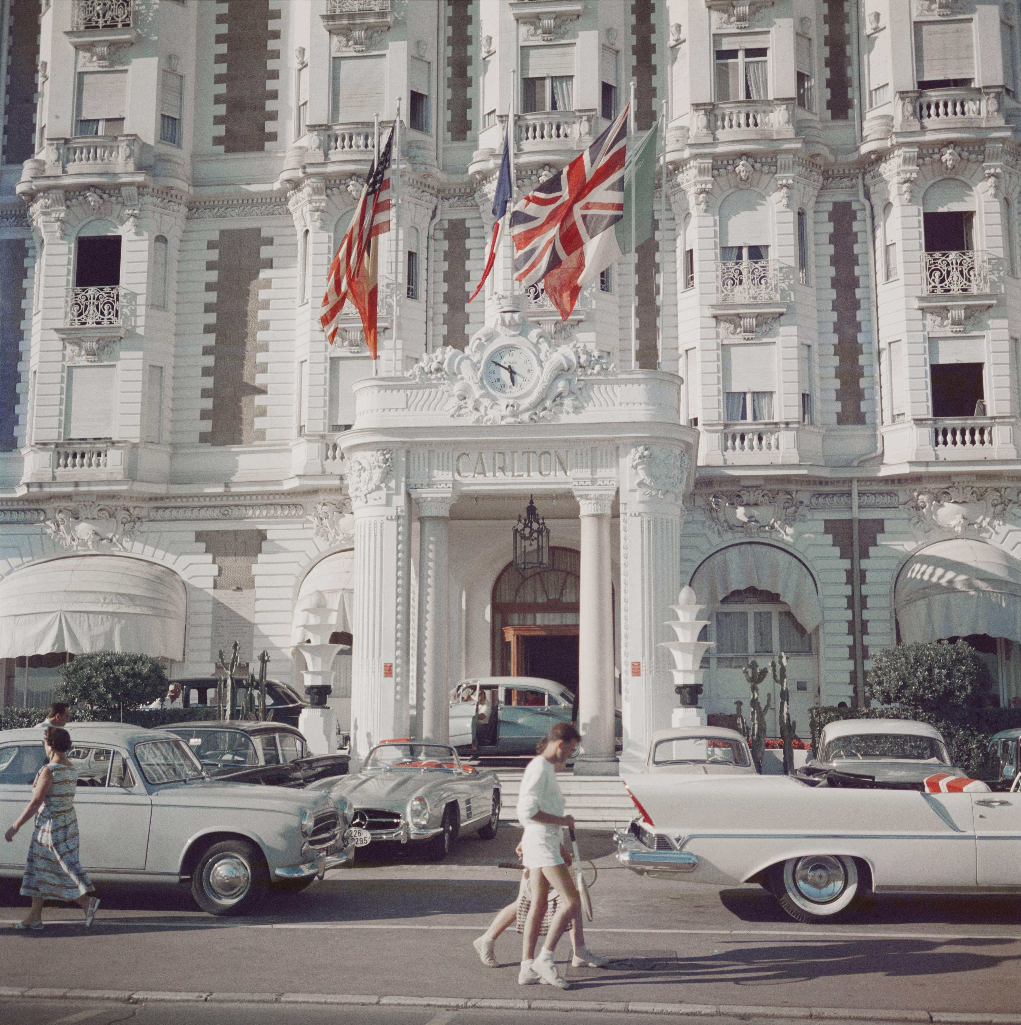 The entrance to the Carlton Hotel, Cannes, France, 1958. (Photo by Slim Aarons/Hulton Archive/Getty Images)

C-type print from the original transparency held at the Getty Images Archive, London.  Numbered and stamped by The Slim Aarons Estate. 