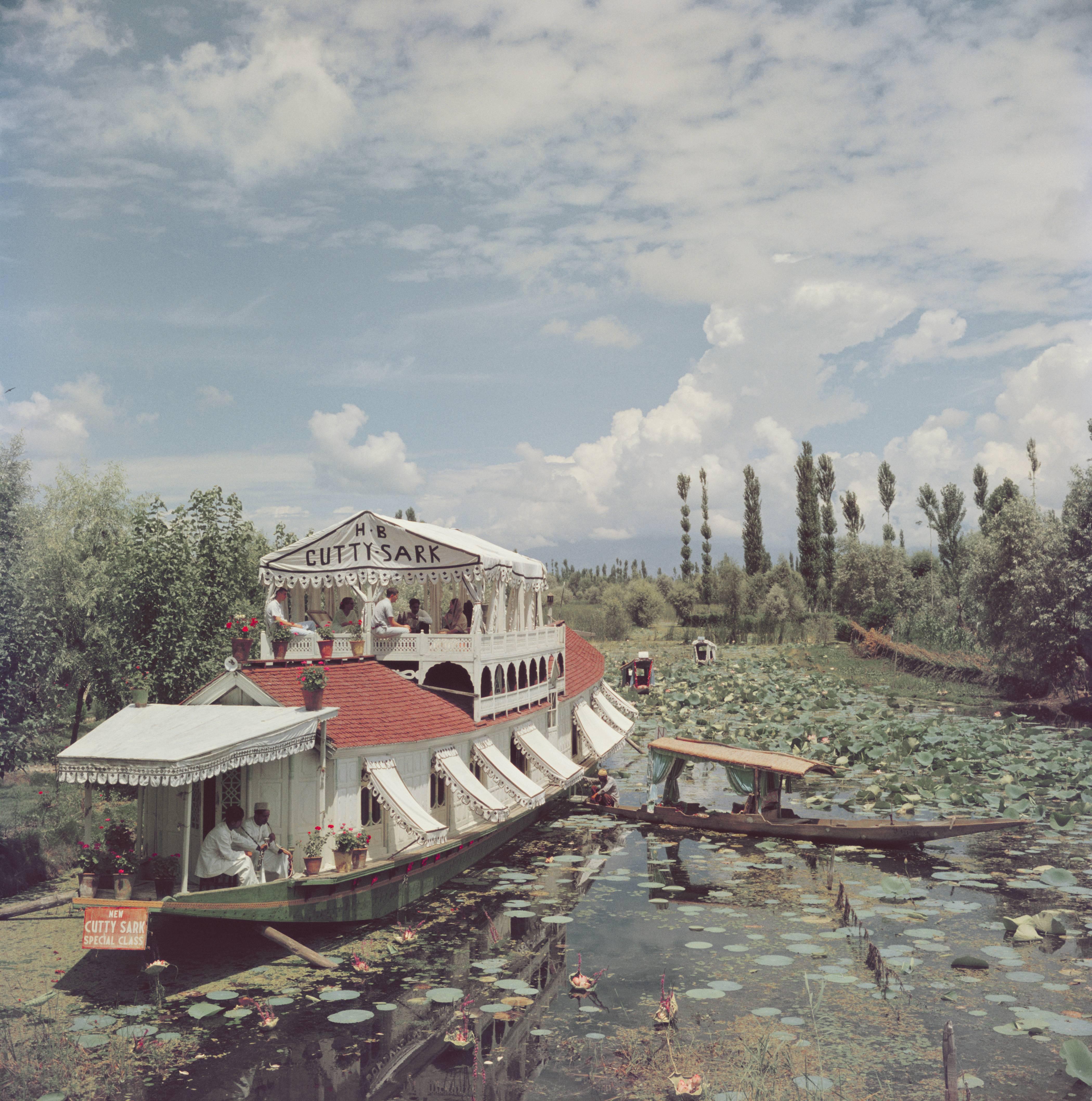 A luxury boat trip on the Jhelum River near Srinagar, in Jammu and Kashmir, India, 1961. The boat is called the 'HB Cutty Sark'. (Photo by Slim Aarons/Getty Images)

C-type print from the original transparency held at the Getty Images Archive,