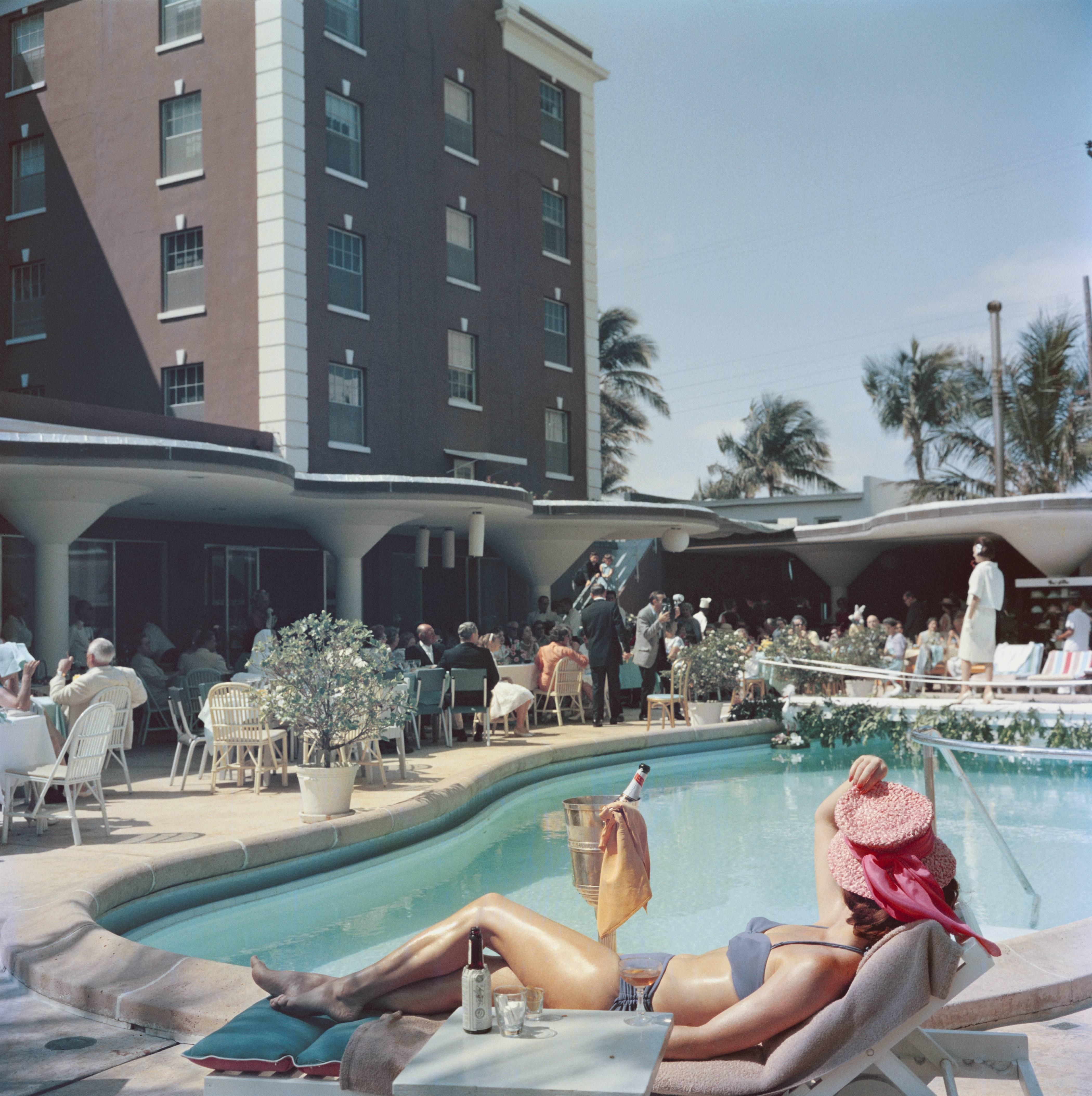 The pool at the Colony Hotel in Palm Beach, Florida, USA, 1955. (Photo by Slim Aarons/Getty Images)

C-type print from the original transparency held at the Getty Images Archive, London.  Numbered and stamped by The Slim Aarons Estate.  Certificate