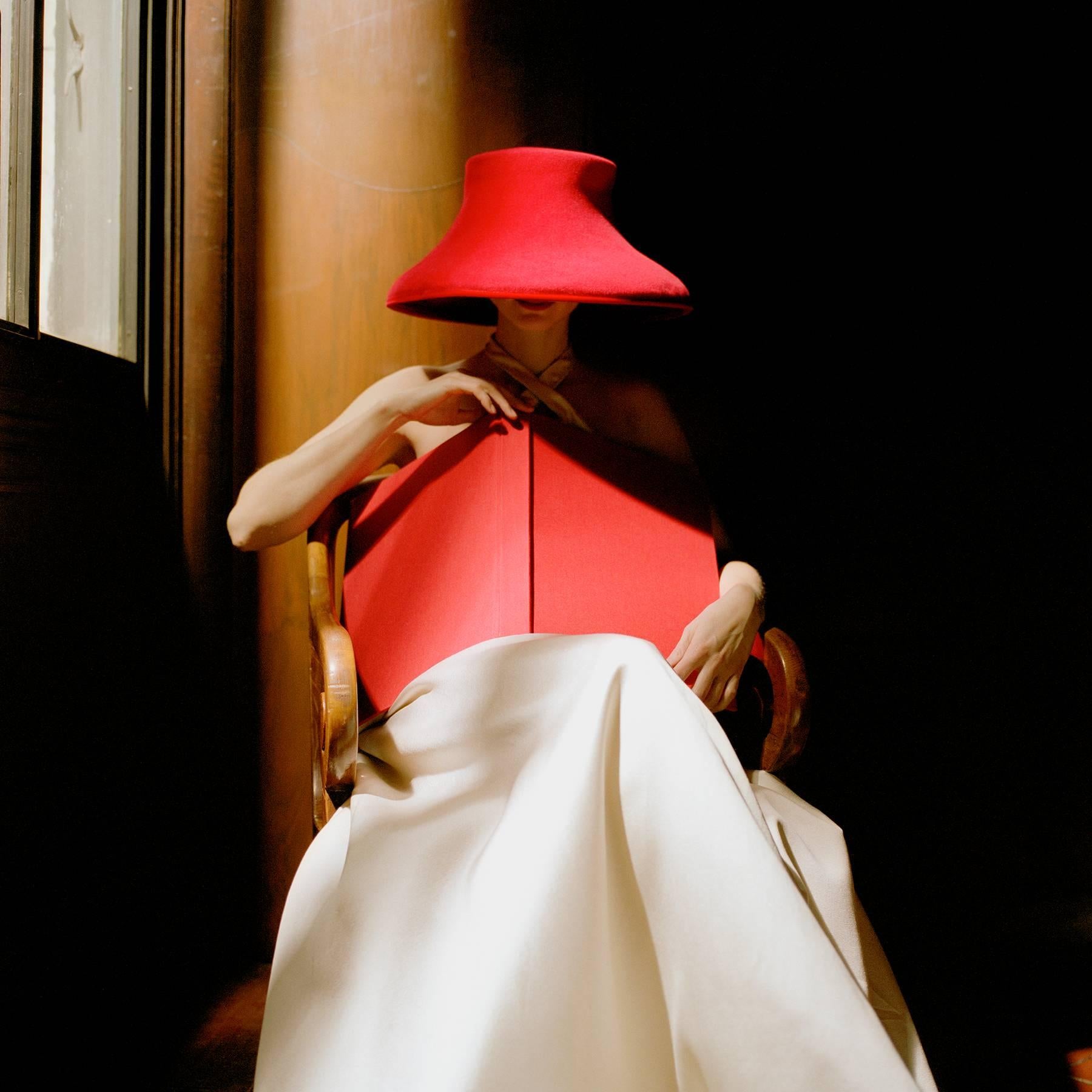 Rodney Smith Figurative Photograph - Bernadette in Red Hat with Book, color fashion photography- 3 Sizes Available