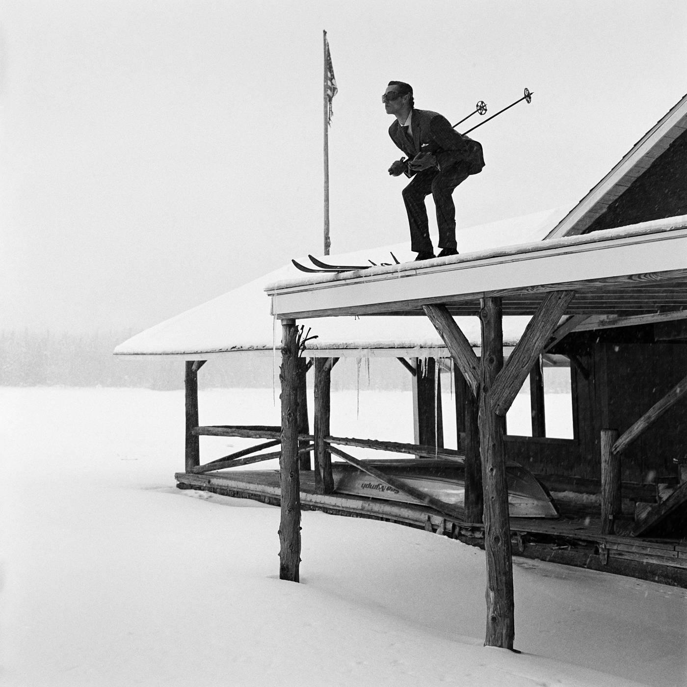 Rodney Smith Black and White Photograph - Reed Skiing off Roof, Lake Placid, New York