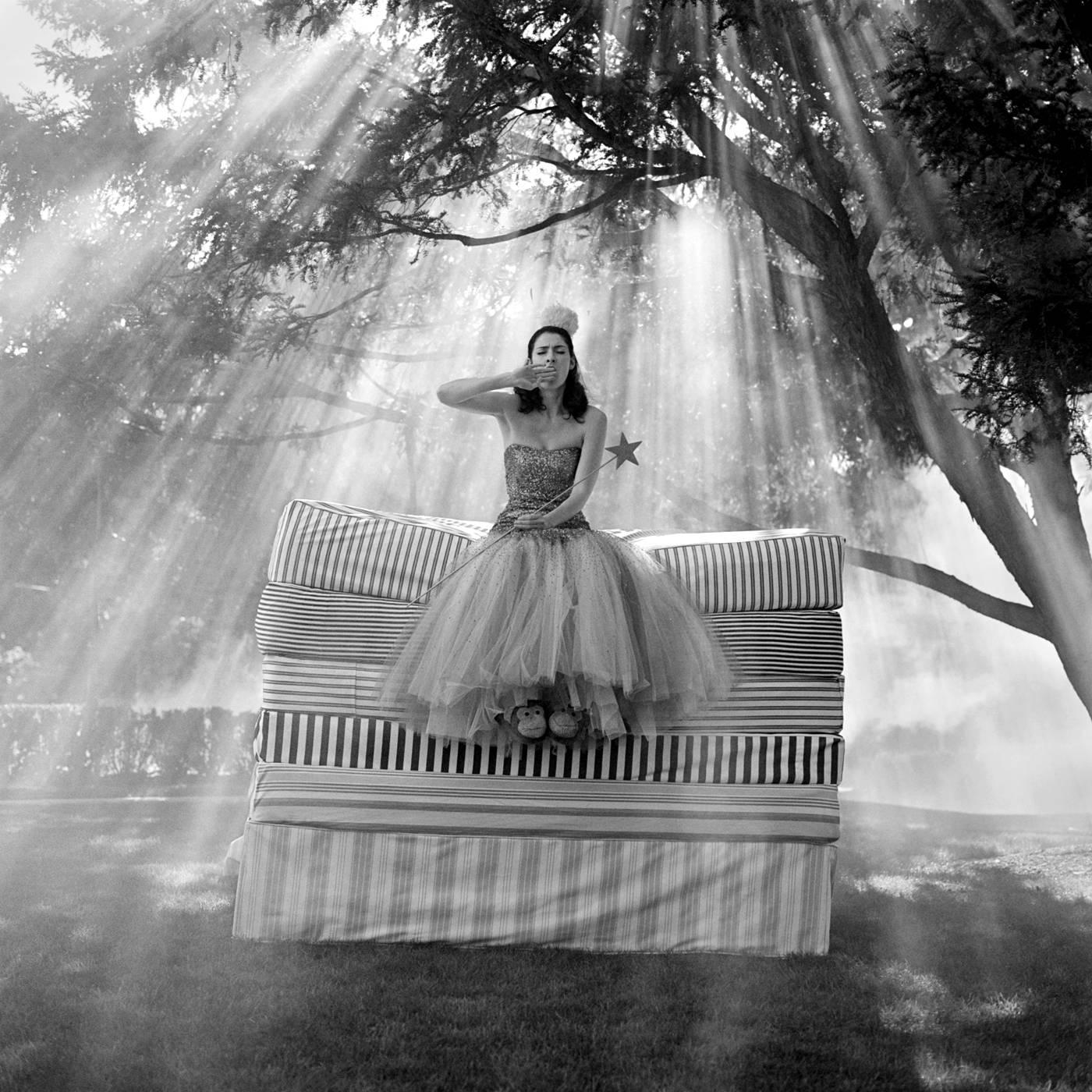 Rodney Smith Black and White Photograph - Zoe on Top of Mattress Stack- black and white 20x 20 inch fashion photograph