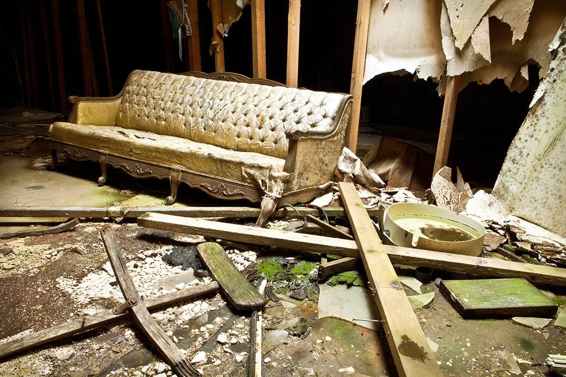 Rebecca Skinner Color Photograph - "Resting", abandoned, mill, vintage, couch, industrial, color photograph
