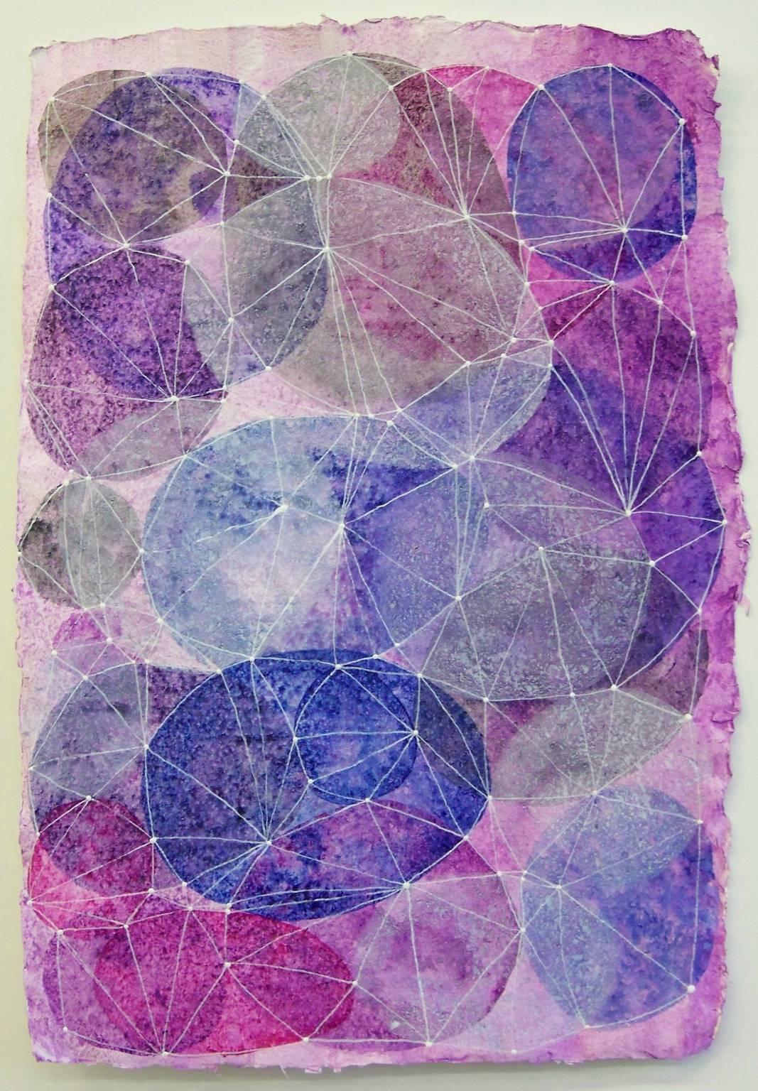 Denise Driscoll's "Inner Garden 16" is an 18 x 12 inch acrylic painting / drawing on handmade paper with a deckle edge. Transparent ovals in magenta, ultramarine blue, violet and white are overlaid with a drawn network of white dots and lines. The