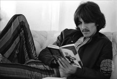 George Harrison reading Bob Dylan by Baron Wolman, 1968