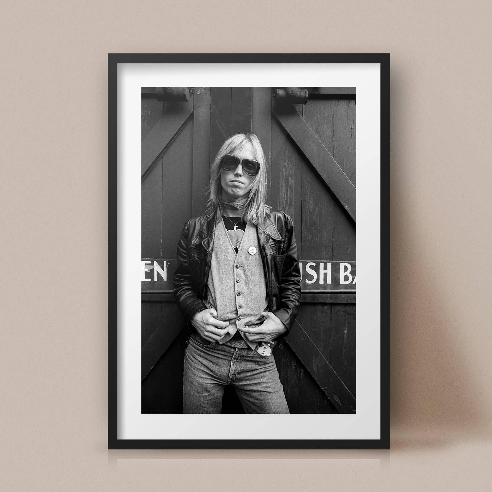Tom Petty photographed behind the San Francisco studio Tom Petty and the Heartbreakers were using in 1979. 

17 x 21 inches
Edition of 25

Adrian Boot, one of Britain’s best known music photographers, began his career in the early 1970’s freelancing