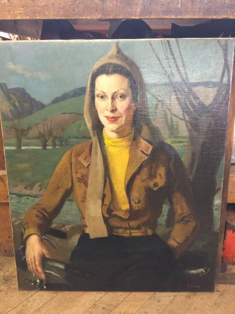 English portrait of a lady from the 1930's with a bicycle in a flying jacket - Painting by John Gilroy
