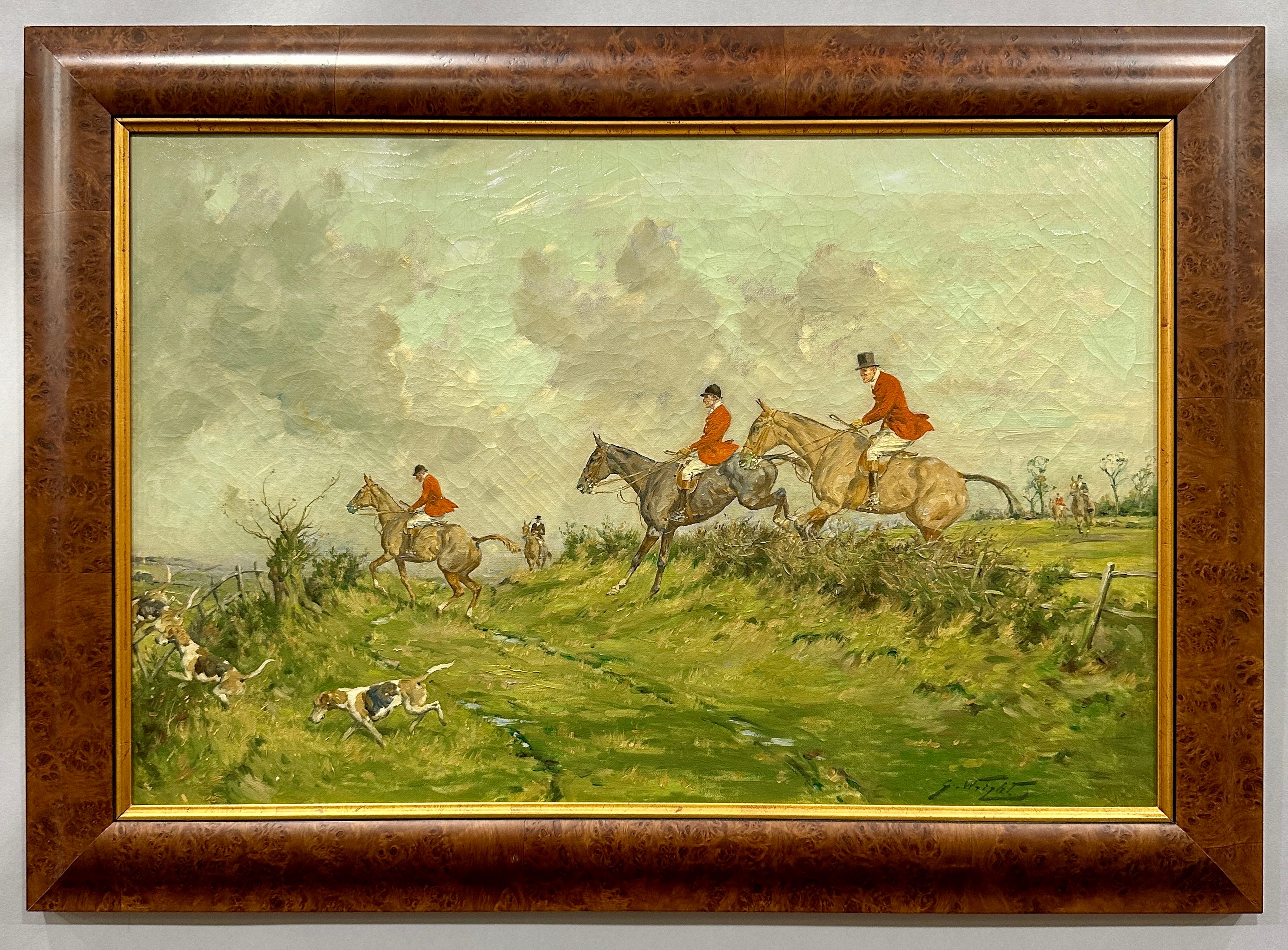 Early 20th century English Fox Huntsman jumping over a hedge with Hounds