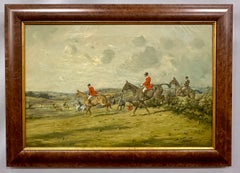 Early 20th century English Fox Huntsman jumping over a hedge with Hounds