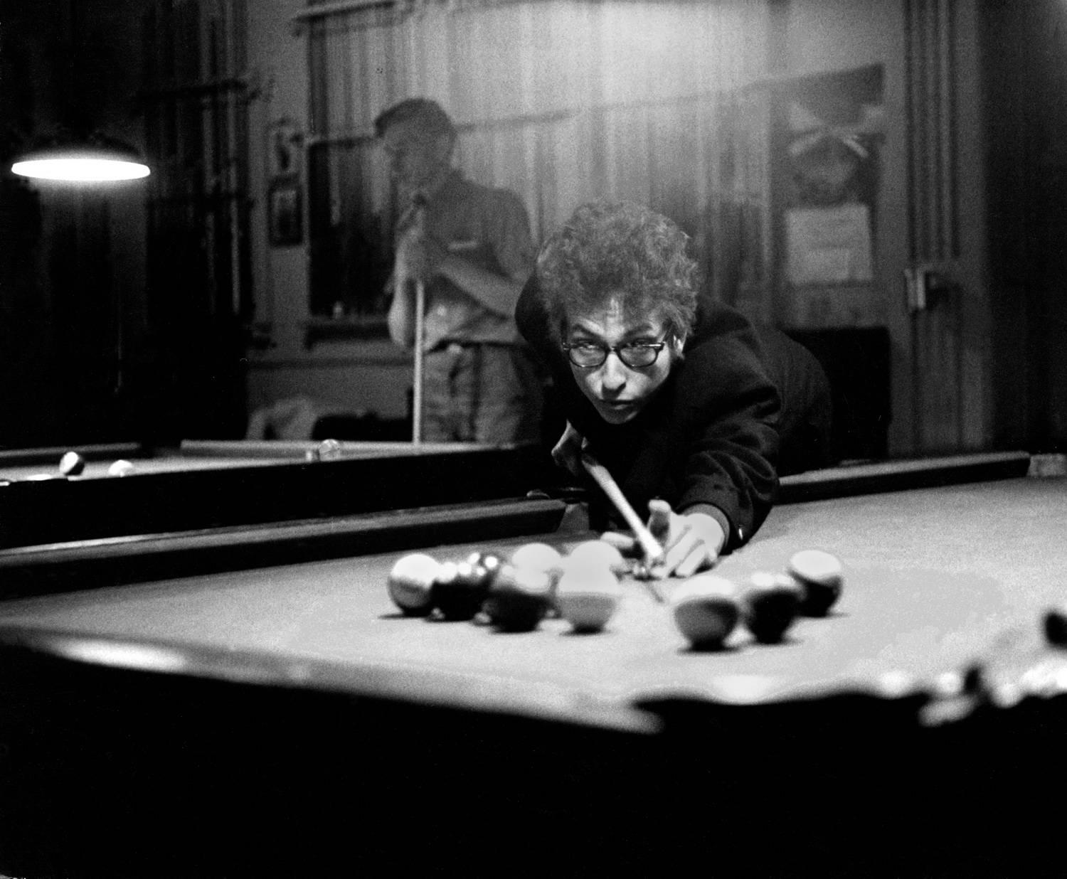 Daniel Kramer Black and White Photograph - Bob Dylan Playing Pool, Kingston, NY