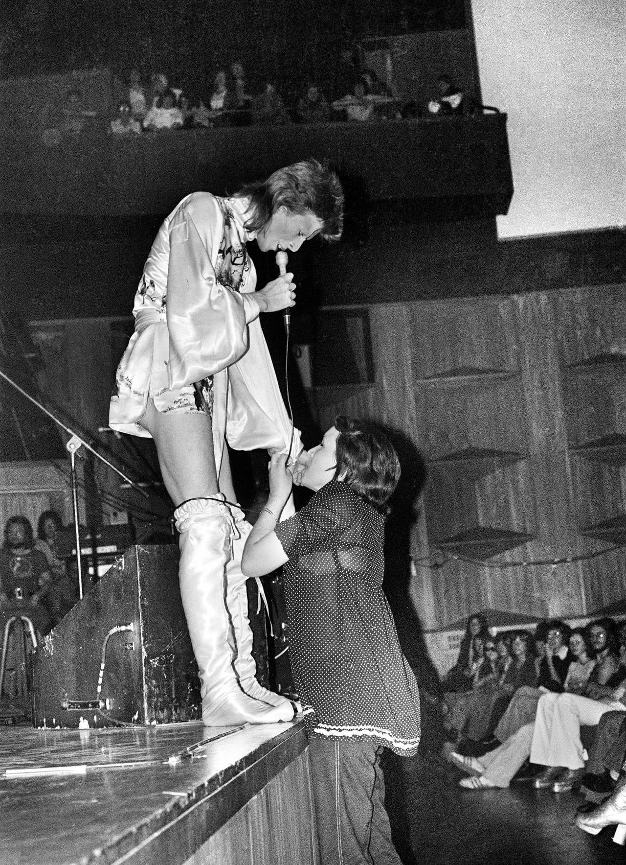 Mick Rock Figurative Photograph - Bowie, Girl Kissing Hand