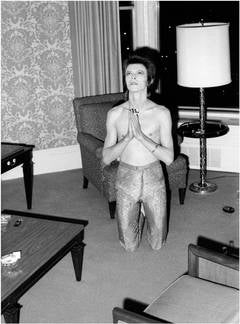 Bowie Praying on Knees