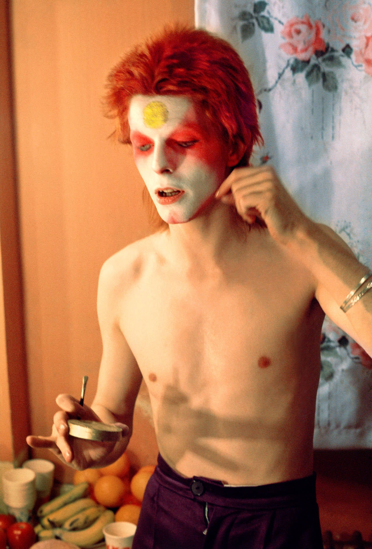 Mick Rock Figurative Photograph - Bowie Pulling off Mask