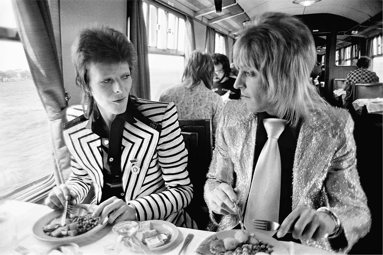 Mick Rock Portrait Photograph - Bowie and Ronson, Lunch on Train to Aberdeen