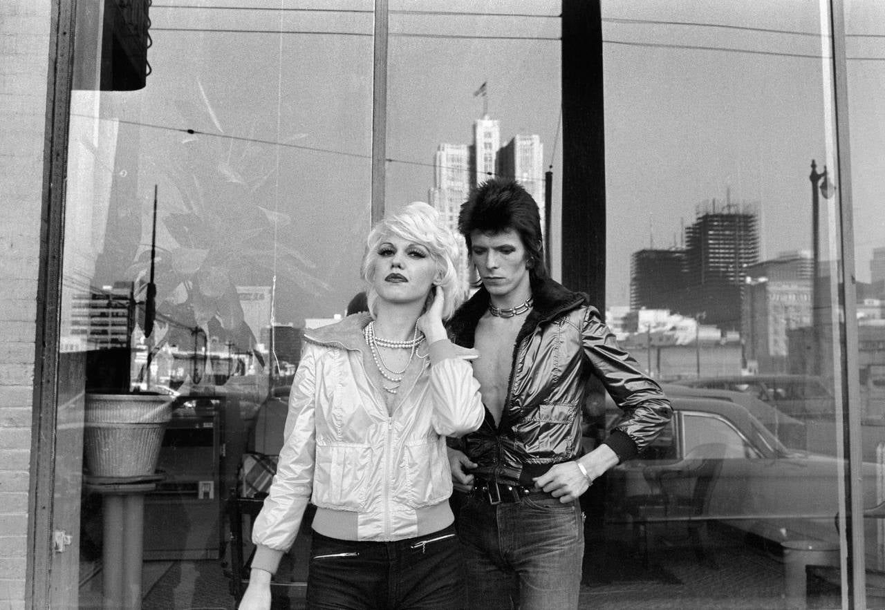 Mick Rock Black and White Photograph - David Bowie with Cyrinda Foxe