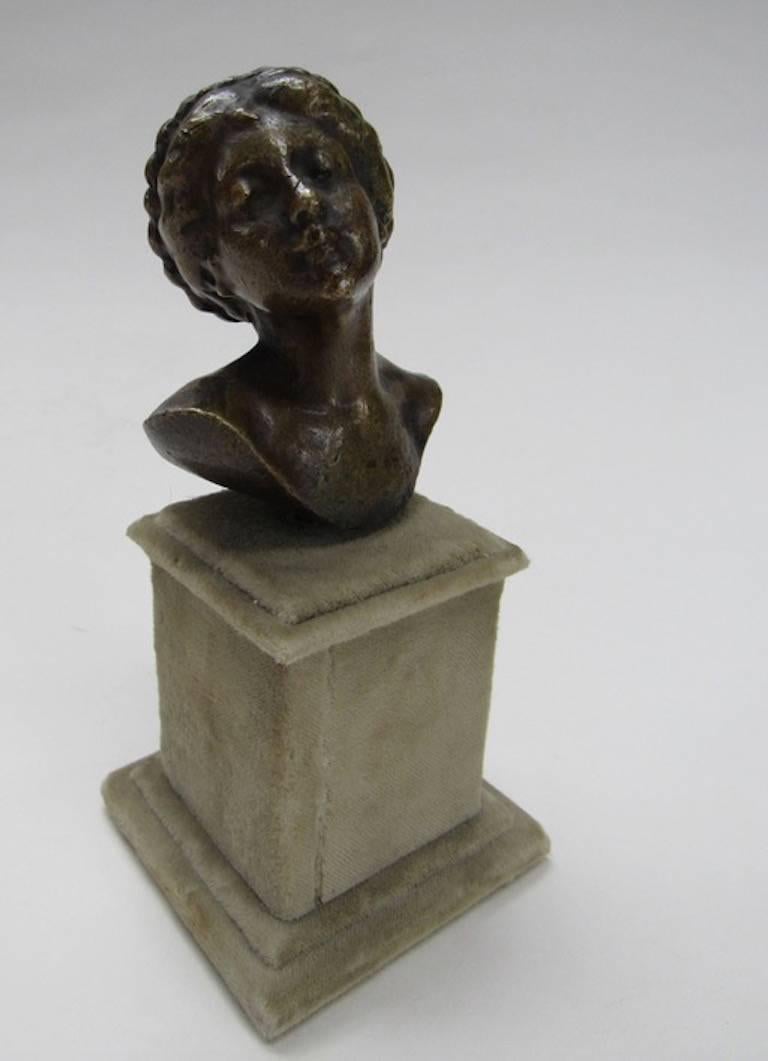 Brass Busy Portrait of Lady with Braided Hair - mounted on felt plinth - Sculpture by Unknown