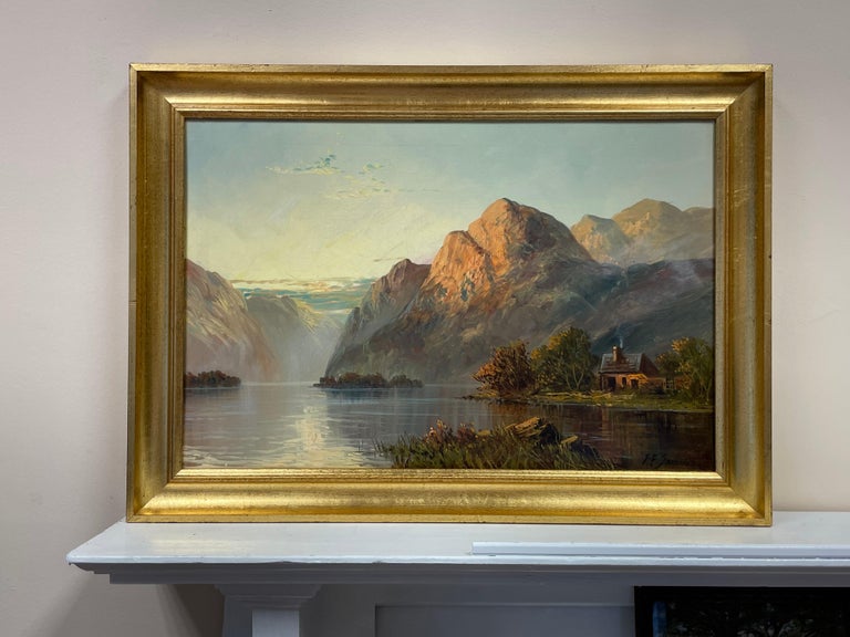 Antique Scottish Highland Loch Scene at Sunset with Cottage Golden Mountains - Painting by Francis E. Jamieson