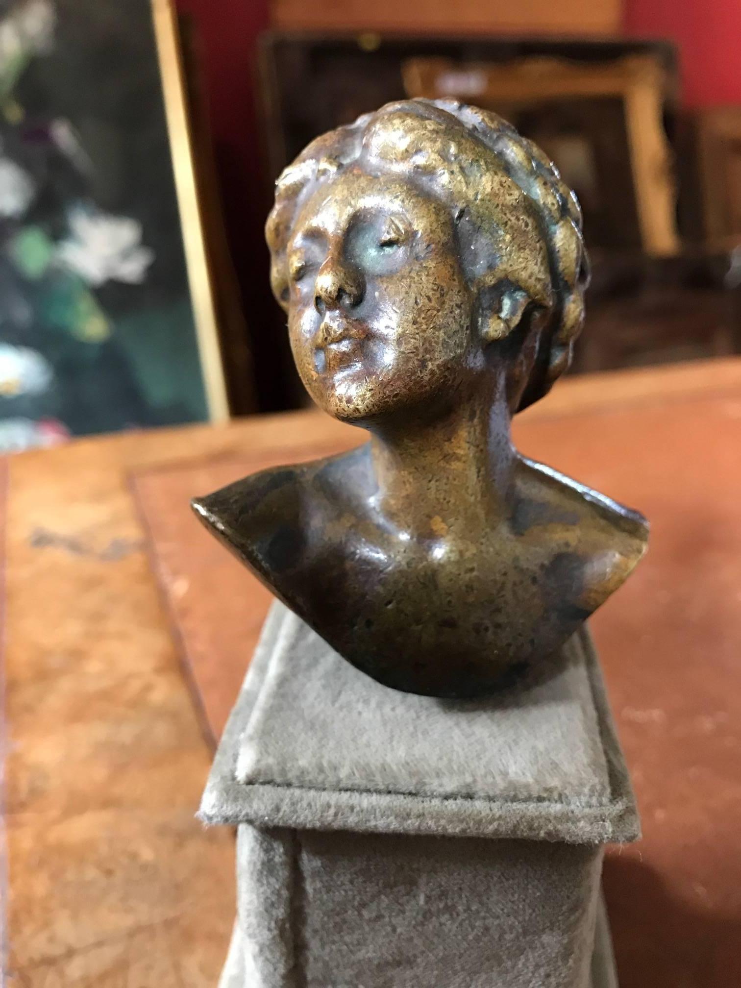 Unknown Figurative Sculpture - Brass Busy Portrait of Lady with Braided Hair - mounted on felt plinth