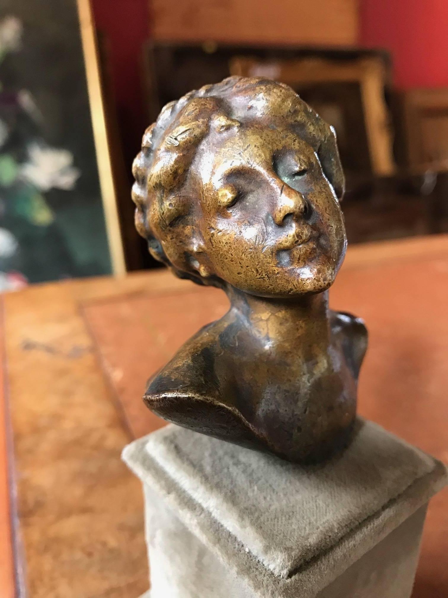 Very fine quality brass sculpture of a lady with braided hair. The work is of French authorship and dates to the early 1900's period. 

Cast in brass and mounted on this grey felt plinth, the work is of exceptional quality and clearly by a very good