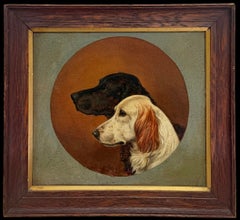 Two Sporting Spaniel Portraits in Profile Against a Circular Ground British Oil