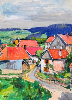 Case di un villaggio francese a Bellefosse con tetti rossi, strada tortuosa e paesaggio montano
