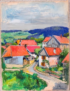 Case di un villaggio francese a Bellefosse con tetti rossi, strada tortuosa e paesaggio montano