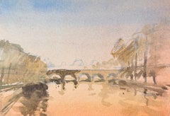 Pont en pierre en arc enjambant la Seine, avec des immeubles parisiens en arrière-plan