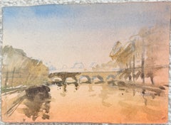Pont en pierre en arc enjambant la Seine, avec des immeubles parisiens en arrière-plan